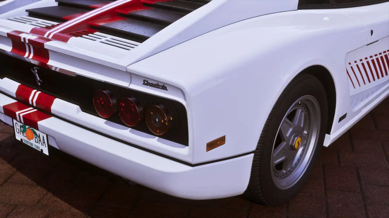 Details of the taillights, make and model logo, plus the license plate of a white Grotti Cheetah with a minimalist, retro-futuristic livery.